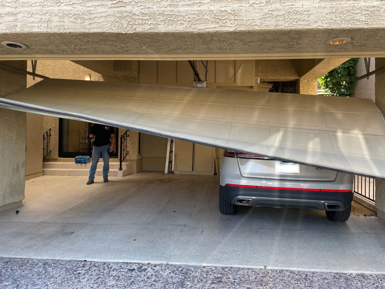 A State 48 technician responding to an emergency garage door repair